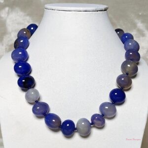 Light and soothing shades of ovoid-shaped sky blue coloured Onyx tumbles come together in this knotted 19” single strand necklace, with a strong spring-ring clasp for durability. DN0015