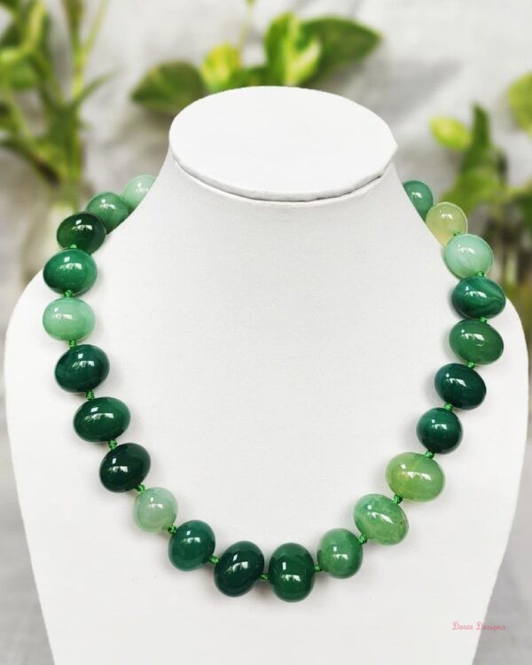 Translucent shades of ovoid-shaped sea green coloured Onyx tumbles come together in this knotted 19” single strand necklace, with a strong spring-ring clasp for durability. DN0018
