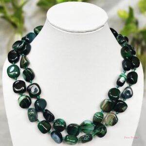 Shades of ovoid-shaped ice-cold sea green and kombu green coloured Onyx tumbles come together in this knotted 38” single strand necklace, with a strong spring-ring clasp for durability. DN0019