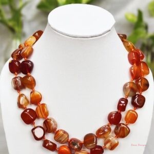Translucent shades of ovoid-shaped toffee orange and burnt sienna coloured Onyx tumbles come together in this knotted 38” single strand necklace, with a strong spring-ring clasp for durability. DN0020