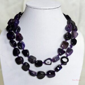 Royal Touch - Delightful irregular tumbles of Onyx in shades of deep royal purple with flecks of white come together in this knotted 36” single strand necklace. DN0023