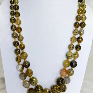 Brown Bash - Knotted 18” double strand of dragon-veined black Onyx beads graded in size, in all shades of tropical yellows and baby browns splotched with brown, black, white, and mossy green. DN0037