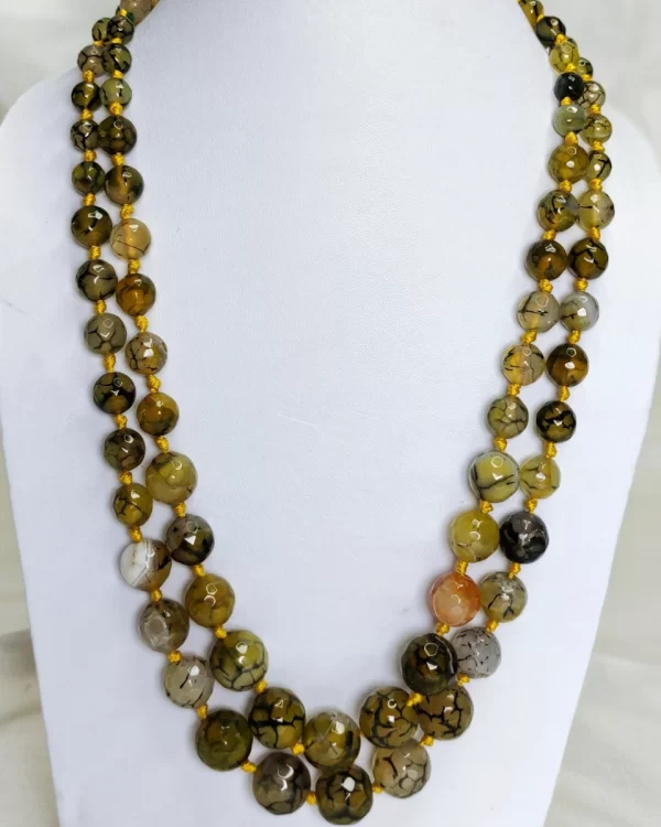 Brown Bash - Knotted 18” double strand of dragon-veined black Onyx beads graded in size, in all shades of tropical yellows and baby browns splotched with brown, black, white, and mossy green. DN0037