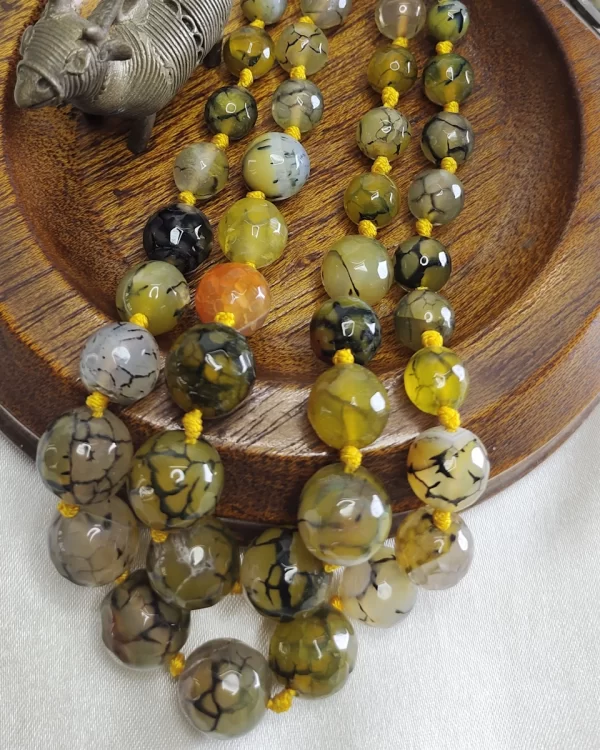 Brown Bash - Knotted 18” double strand of dragon-veined black Onyx beads graded in size, in all shades of tropical yellows and baby browns splotched with brown, black, white, and mossy green. DN0037