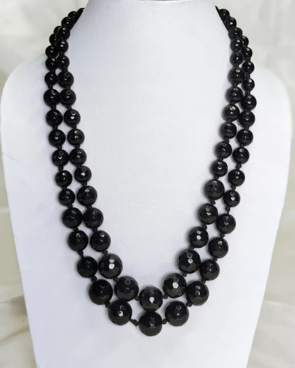 Winter Black - Knotted 18” double strand of Onyx beads graded in size, in deep shades of jet black. DN0039