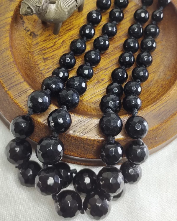 Winter Black - Knotted 18” double strand of Onyx beads graded in size, in deep shades of jet black. DN0039