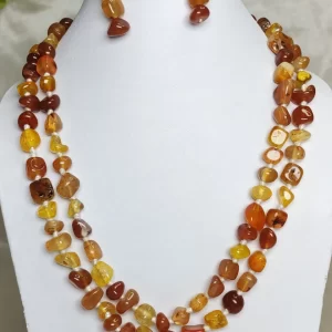 Tropical Touch - DN0476 - Onyx tumbles in all shades of warm brown honey and treacle stand out in this wonderful 36” knotted creation.