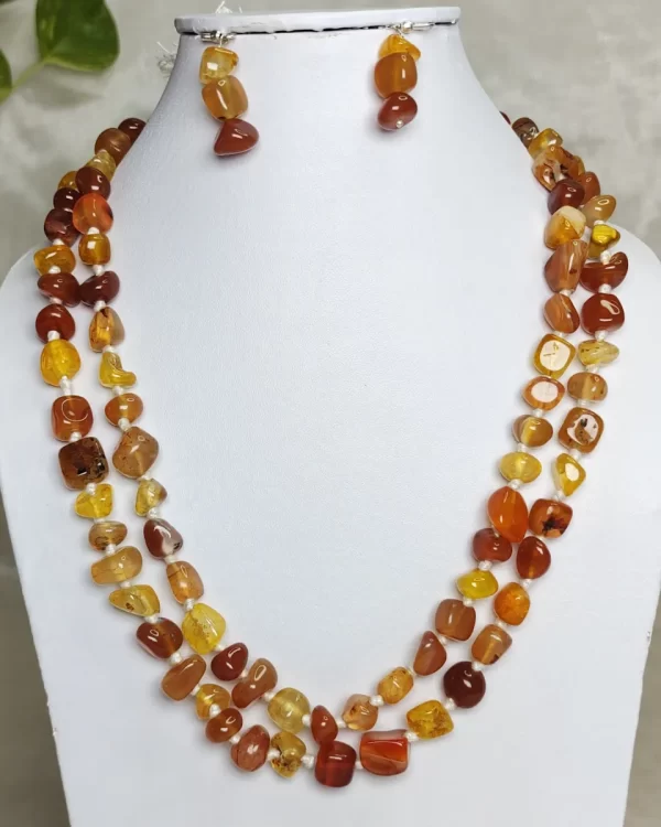 Tropical Touch - DN0476 - Onyx tumbles in all shades of warm brown honey and treacle stand out in this wonderful 36” knotted creation.
