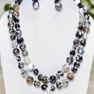 Chiaroscuro - DN0494 - Delicate but boldly splotched white and black Onyx beads in an enticing 40” knotted stunner.