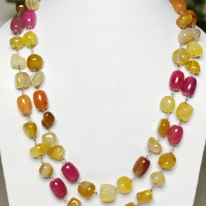 Fruit Punch - DN0522 - Spectacular all-the-shades-of-tropical-fruit Onyx tumbles in a 40” chain linked wonder piece.