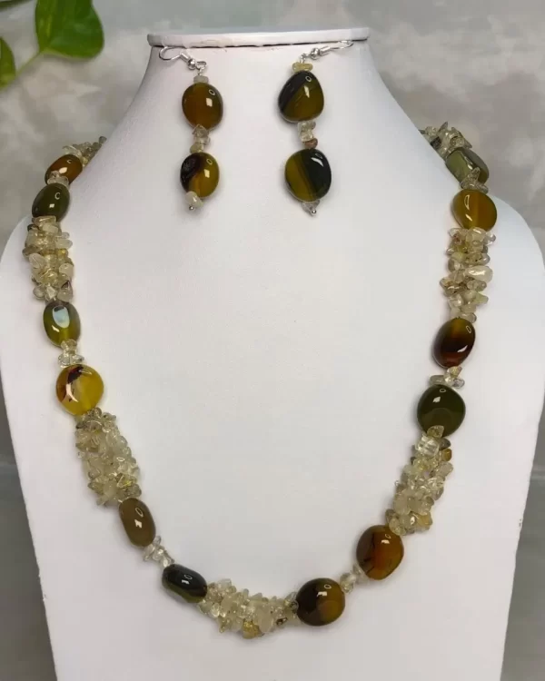 Memsahib - DN0585 - Three strands of Rock Crystal chips pool up with mossy green and woodland brown Onyx tumbles to form this refined 19” necklace.